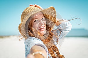 Smiling mature woman with straw hat